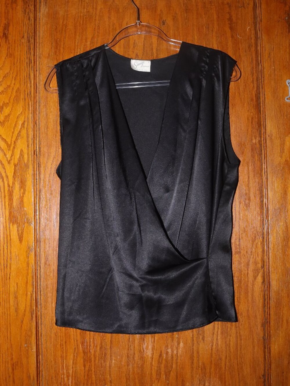 Vintage Black Satin Sleeveless Wrap-Front Blouse with a Draped V-neck.